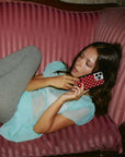 Lifestyle Image 02 Polka Dot Burgundy and Cream iPhone Case